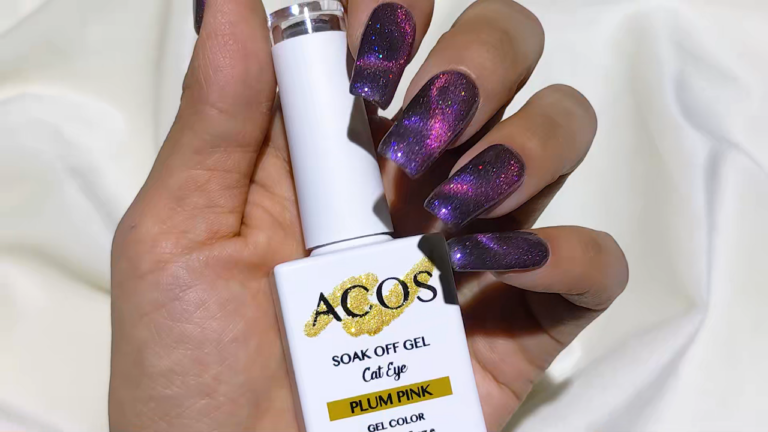 Hand holding ACOS Soak Off Gel Cat Eye nail polish in Plum Pink with glittery purple and pink cat eye nails.