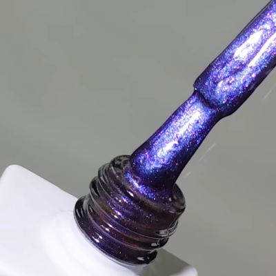 Close-up of ACOS Cat Eye Gel brush with glittery purple gel